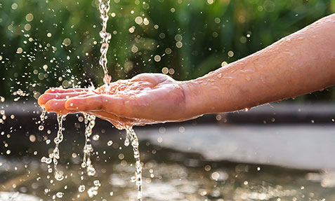Hand and water
